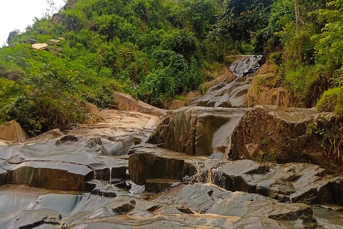 Hiking Binana Mountain & Waterfalls in Rwanda - Crossing the suspension bridge near Vunga